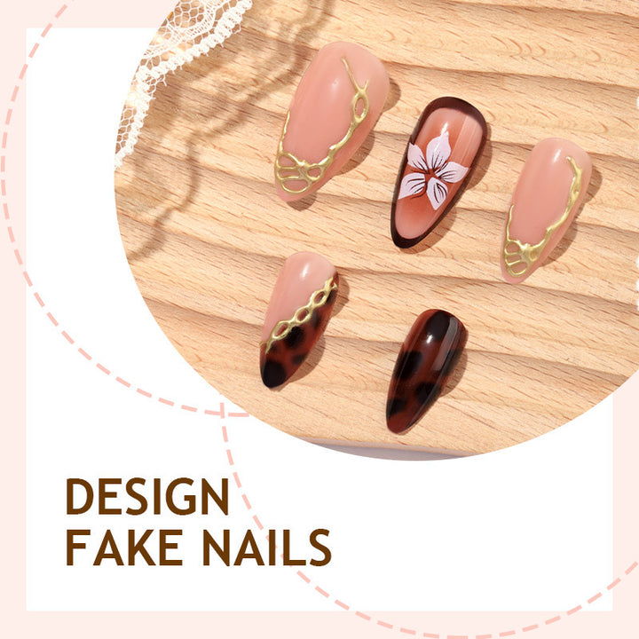 Kunstnagelset mit eleganten floralem Dekor und Glitzerelementen Karnz