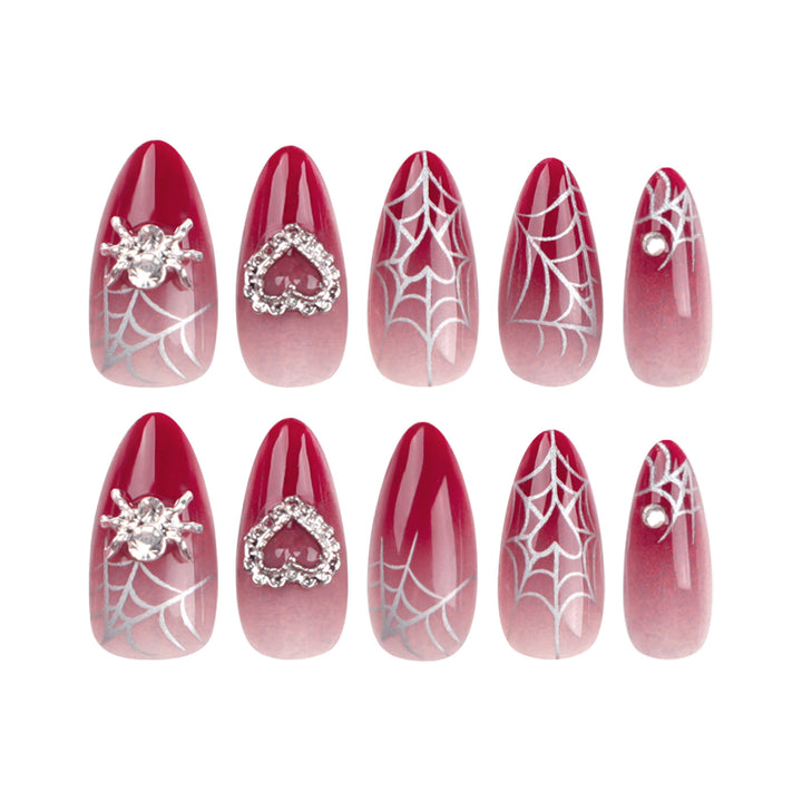 Kunstnagelset mit filigranen Spinnennetz-Design und Glitzer-Akzenten Karnz