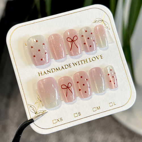 Künstliche Nagelkunst mit niedlichen Schleifen-Design Karnz