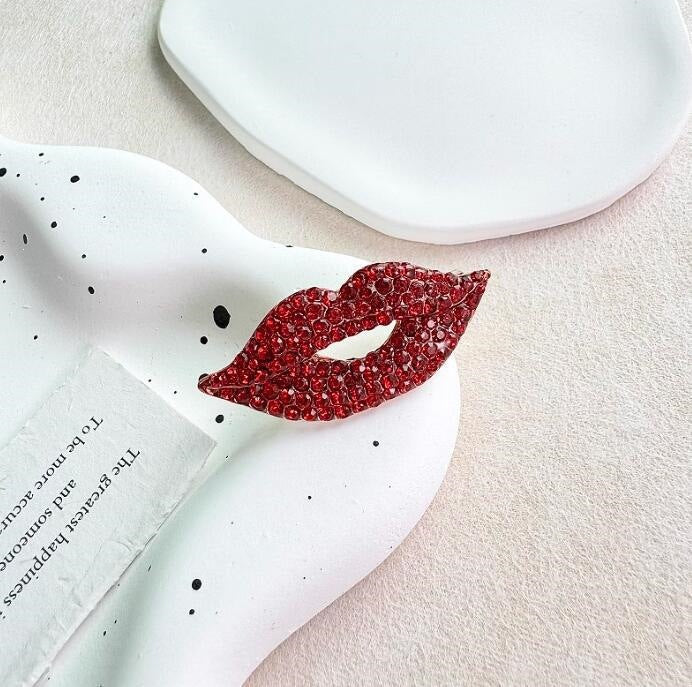 Glitzernde Lippenbrosche Karnz