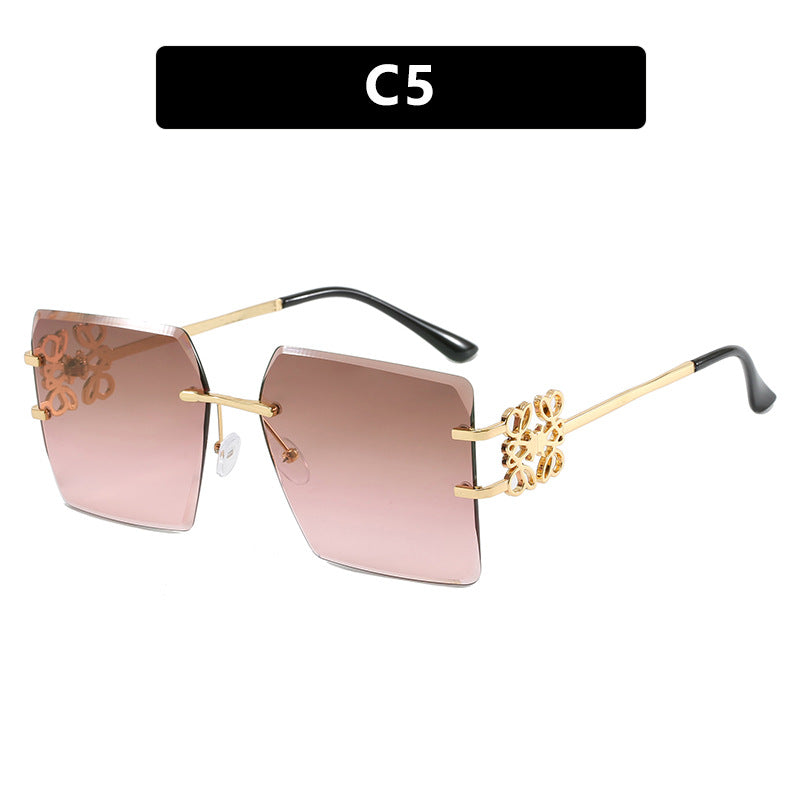 Damen modische Sonnenbrille mit außergewöhnlichem Design und goldenen Akzenten Karnz