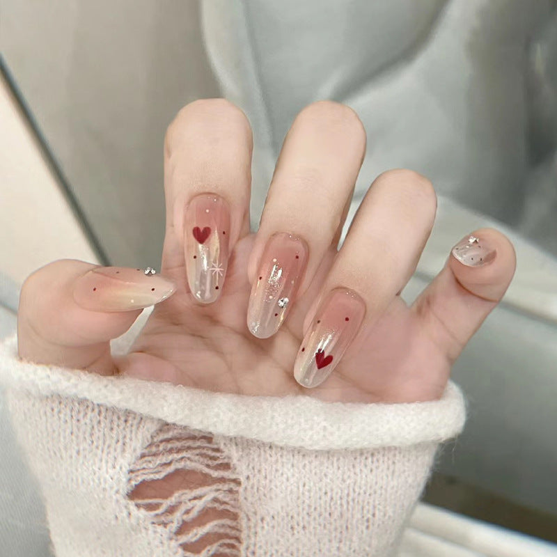 Elegantes Press-On-Nageldesign mit Strassakzenten Karnz