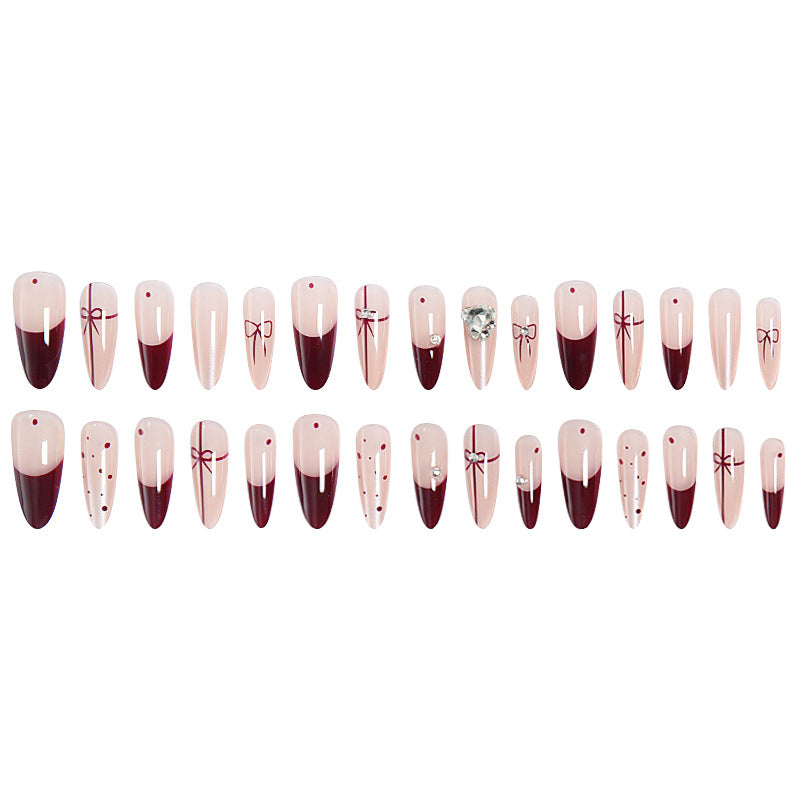 Kunstnagelset mit eleganten Schleifen- und Glitzer-Details Karnz