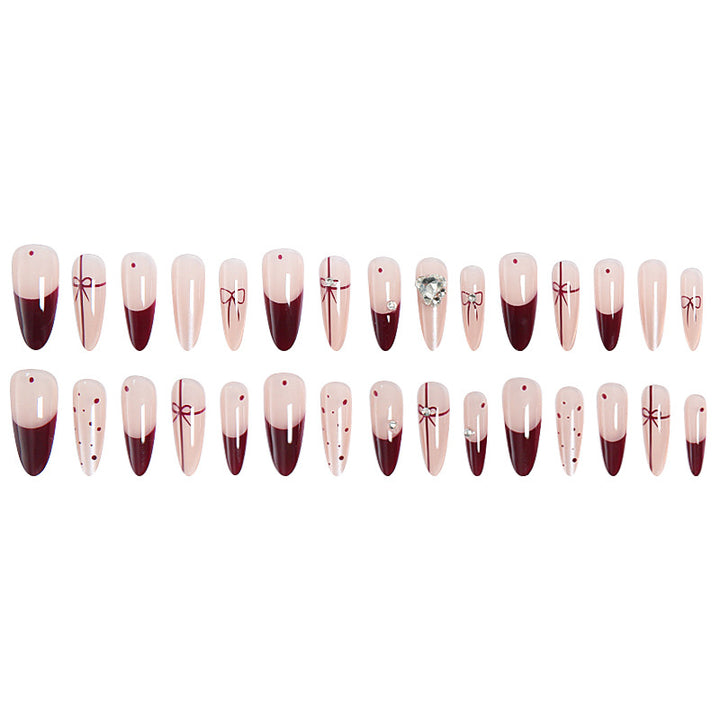 Kunstnagelset mit eleganten Schleifen- und Glitzer-Details Karnz