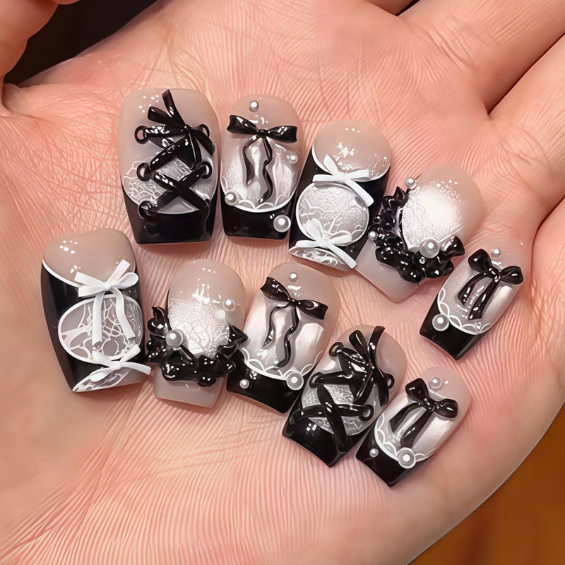 Dekoratives Press-On-Nagelset mit Stern- und Schleifenmotiven Karnz