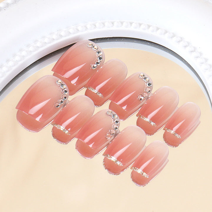 Elegante Ombre Press-On Nagelset mit dekorativen Strassakzenten Karnz