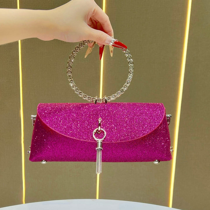 Glitzernde Clutch mit Strassgriff für den Abend