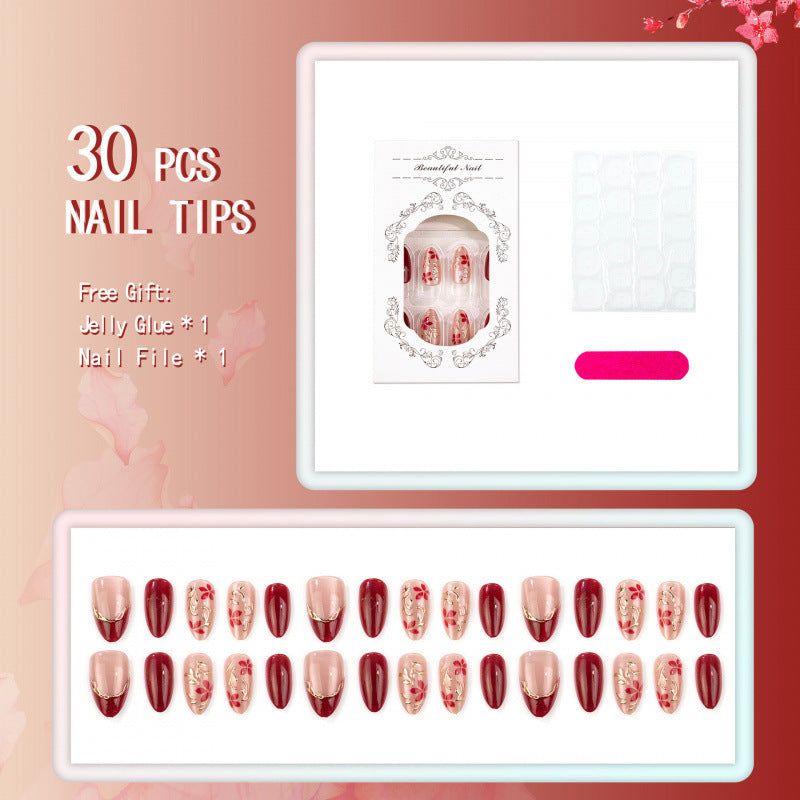 Künstlerisches Press-On Nagelset mit floralen und metallischen Akzenten