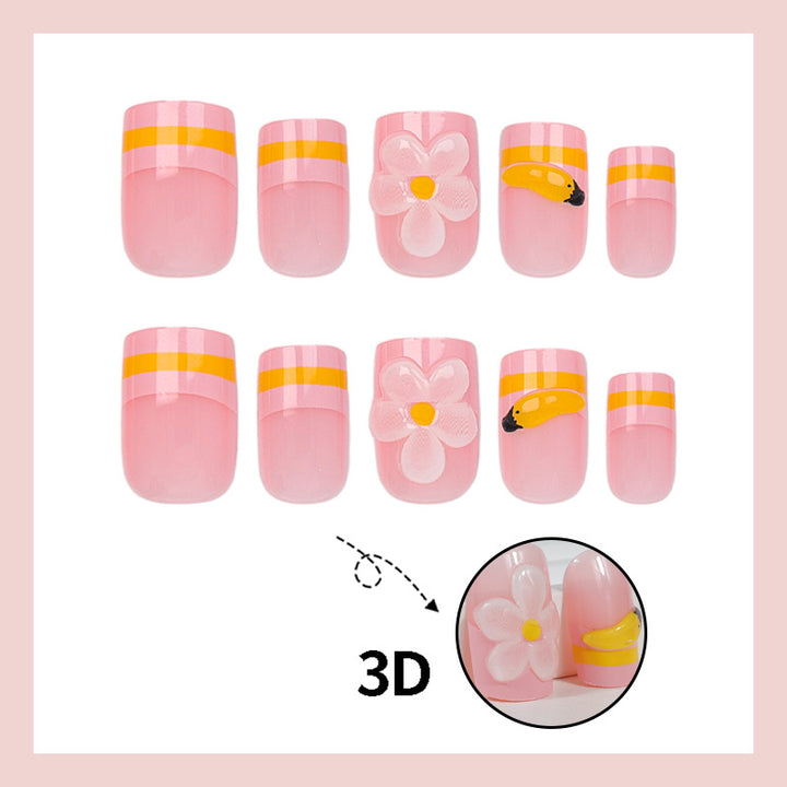 Kunstnagelset mit verspielten Blumen- und Fruchtmotiven Karnz