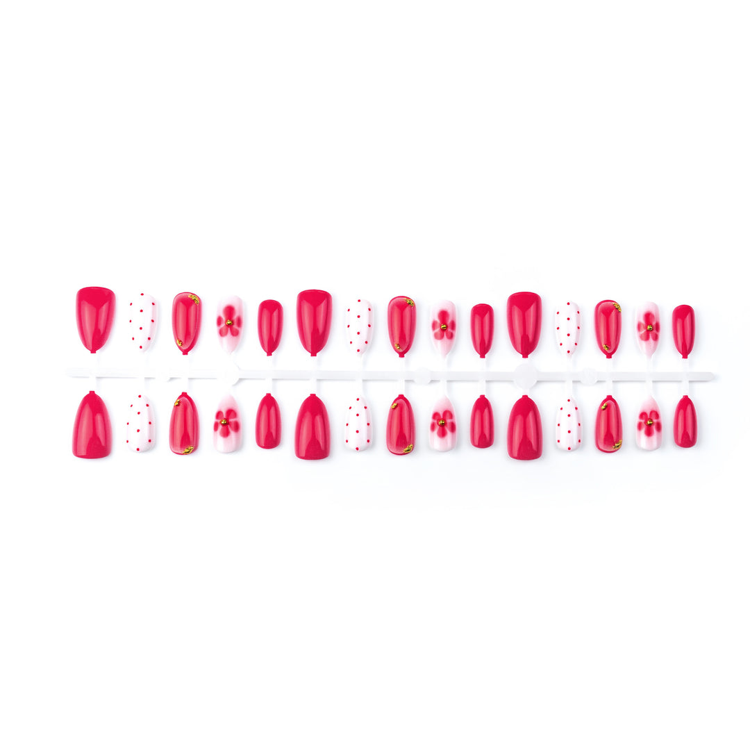 Künstlerisches Press-On-Nagelset mit Blumen- und Punktdesigns