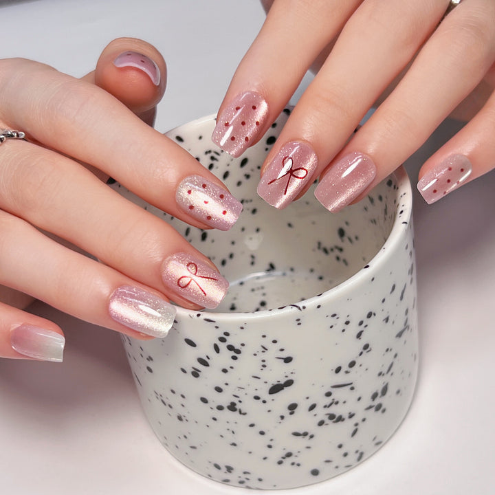 Künstliche Nagelkunst mit niedlichen Schleifen-Design Karnz