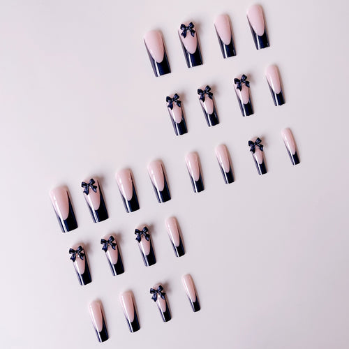 Elegante Kunstnagelspitzen mit Schleifenverzierungen Karnz