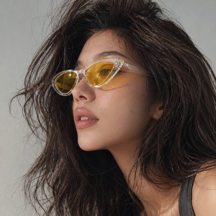 Damen Cat-Eye Sonnenbrille mit transparenter Rahmenkonstruktion und gelben Gläsern Karnz