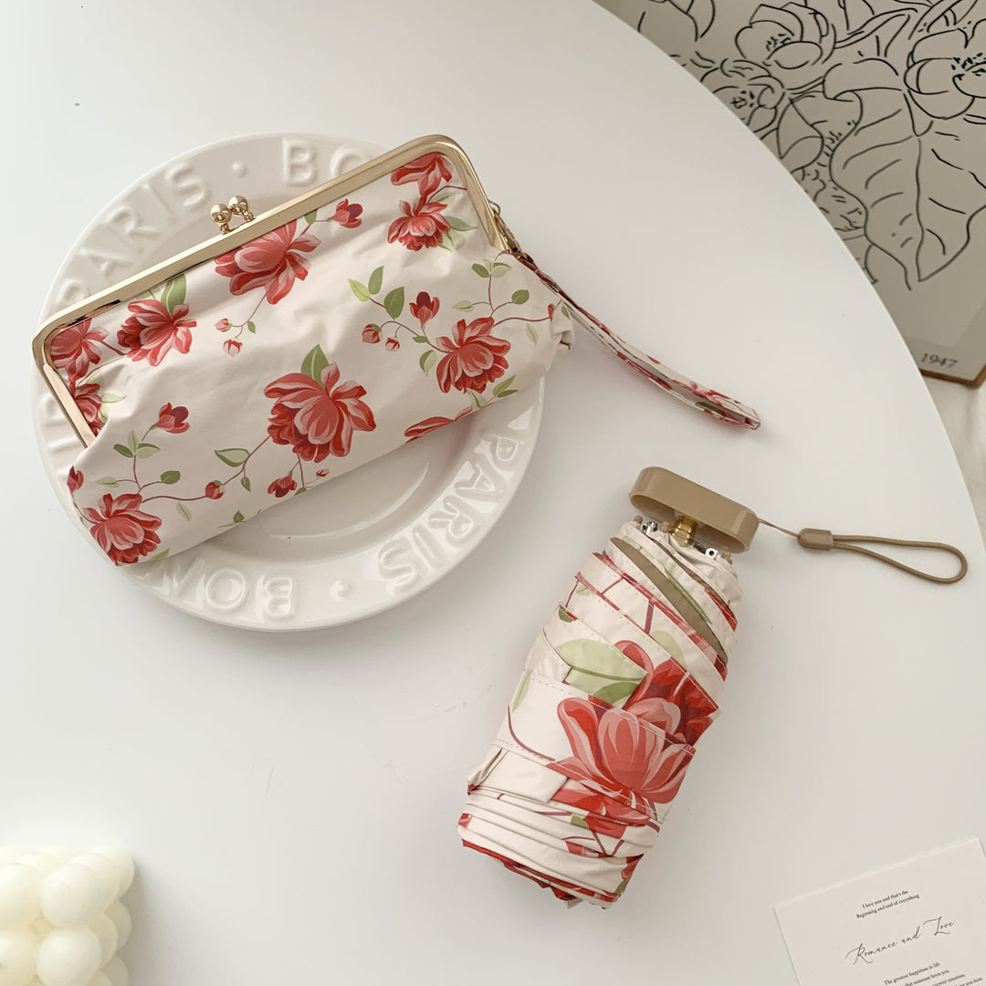 Damen eleganter Faltregenschirm mit floralem Design und praktischem Etui Karnz