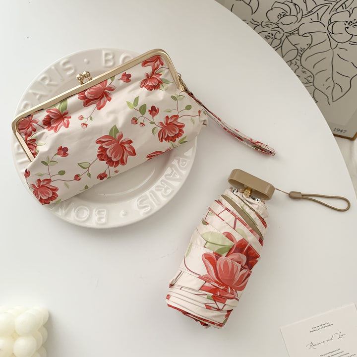 Damen eleganter Faltregenschirm mit floralem Design und praktischem Etui Karnz