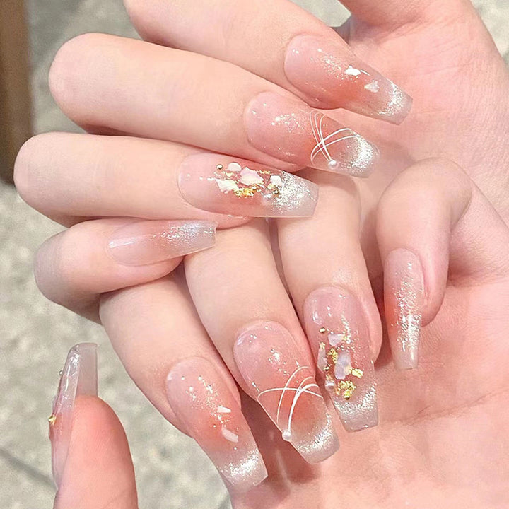 Kunstnagelset mit eleganten Glitzer- und Blumendekoren Karnz