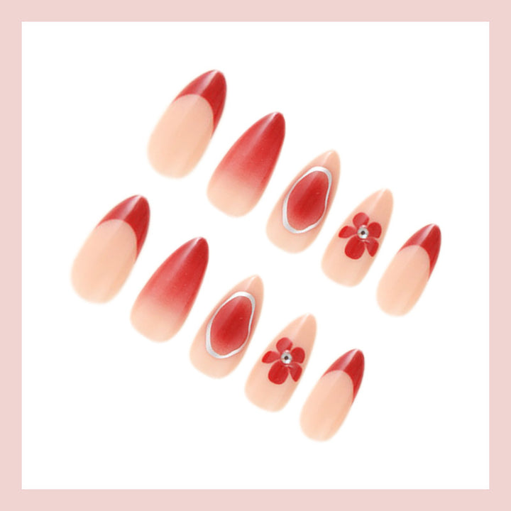 Kunstnagelset mit eleganten Blüten- und Ombre-Akzenten Karnz