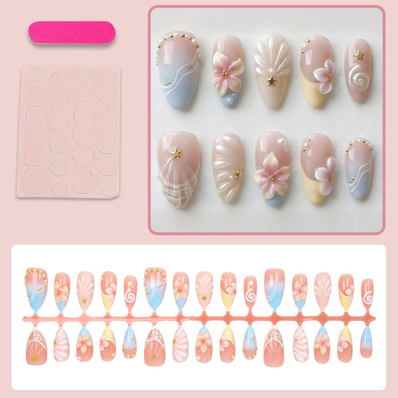 Kunstnagelset mit elegantem Blüten- und Muscheldesign Karnz