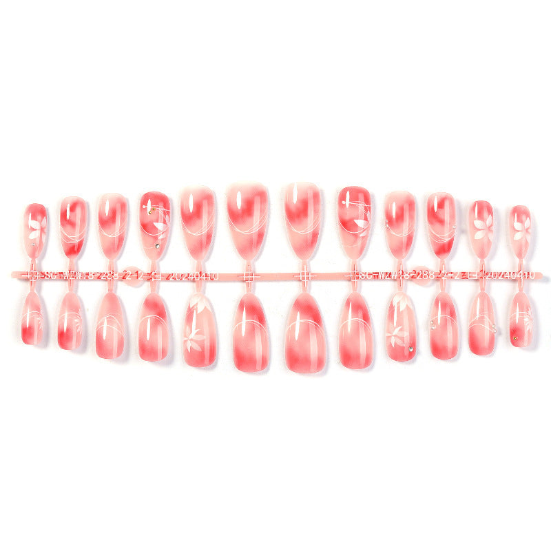 Kunstnagelset mit elegantem Ombre-Design und floralem Akzent Karnz