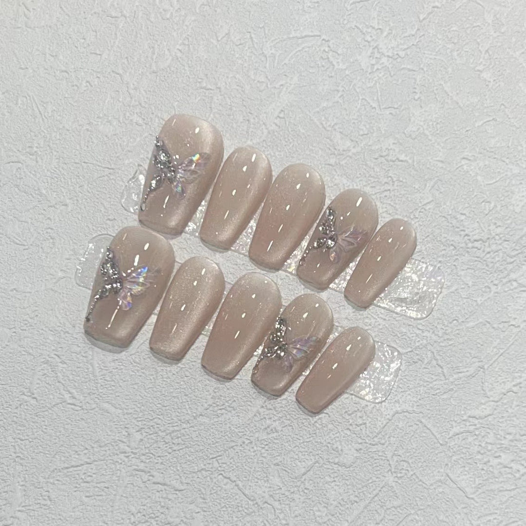 Stilvolles Press-On Nagelkunst-Set mit eleganten Schmetterlings- und Juwelenelementen Karnz