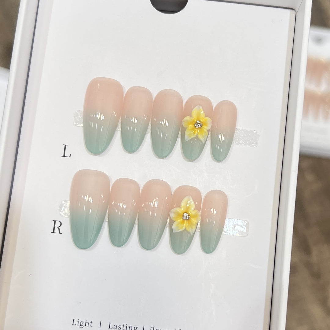 Elegante Ombre Press-On Nagelset mit floralen Akzenten Karnz