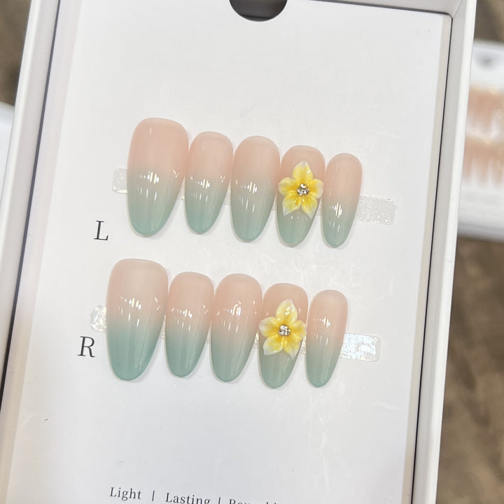 Elegante Ombre Press-On Nagelset mit floralen Akzenten Karnz