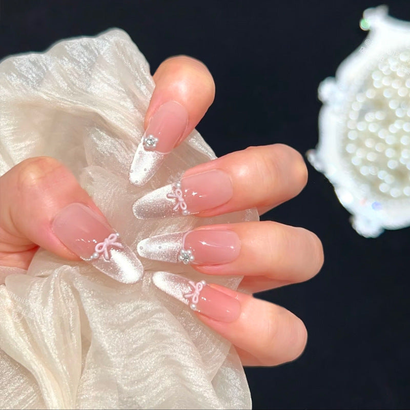 Kunstnagelset mit eleganten Schleifen- und Strassverzierungen Karnz