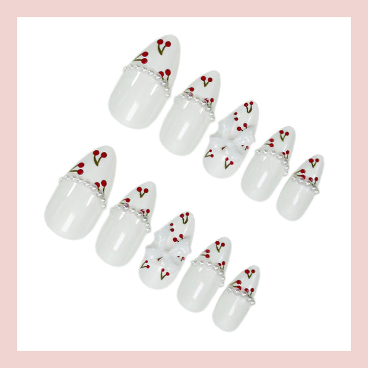 Kunstnagelset mit floralen Cherrymotiven und eleganten Schleifen Karnz