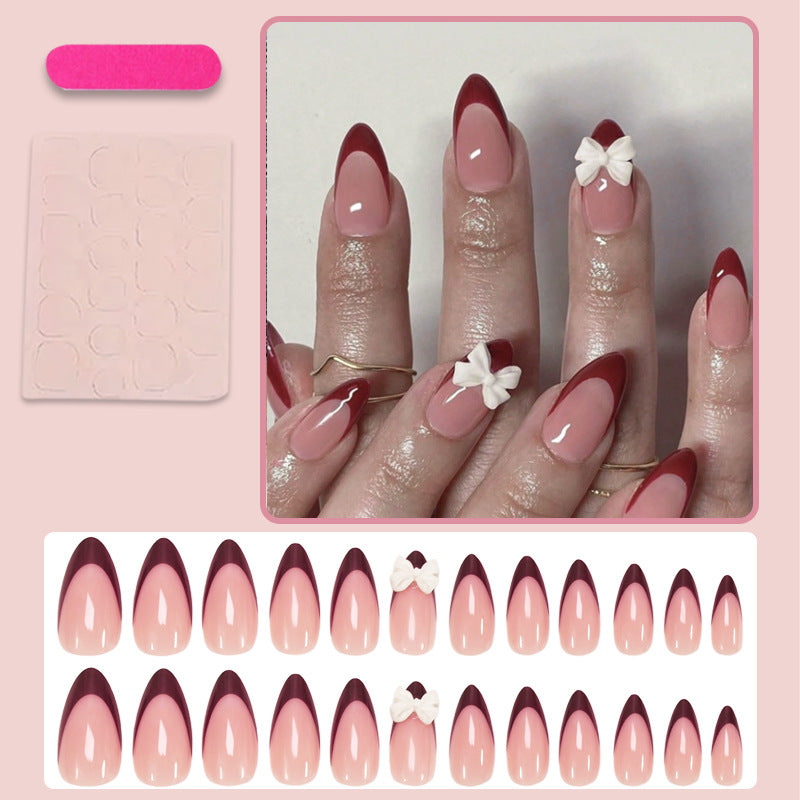 Kunstnagelset mit elegantem Spitzen-Design und romantischen Schleifen Karnz