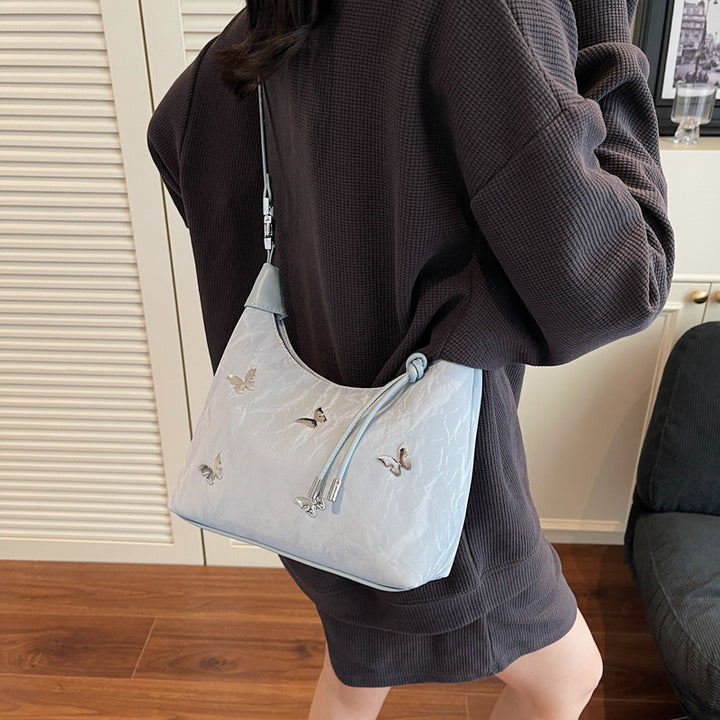 Stylische Handtasche mit Schmetterlingsdetail Karnz