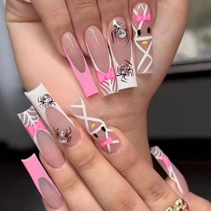 Künstlerische Press-On-Nagelerweiterungen mit Spinnen- und Schleifen-Design Karnz