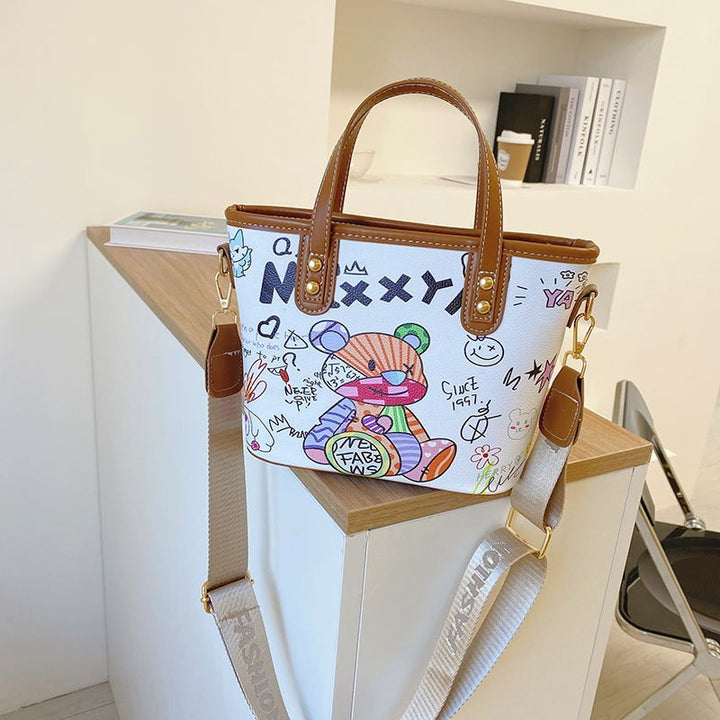Verspielte illustrierte Schultertasche