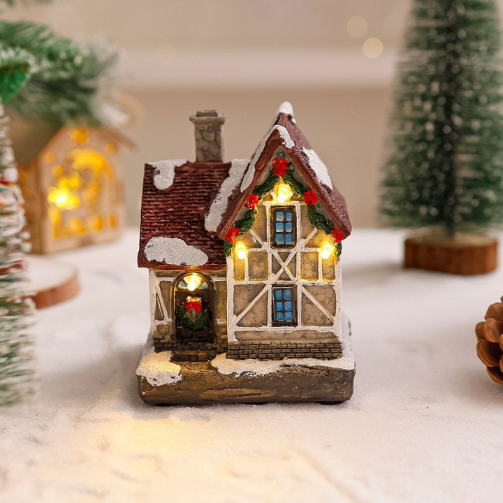 Dekoratives Weihnachtsdorf mit Lichtern Karnz
