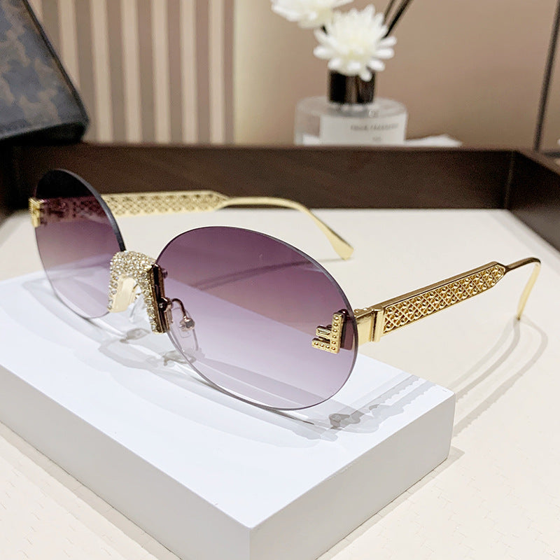 Damen Sonnenbrille mit glitzerndem Rahmen und ovalen Gläsern Karnz