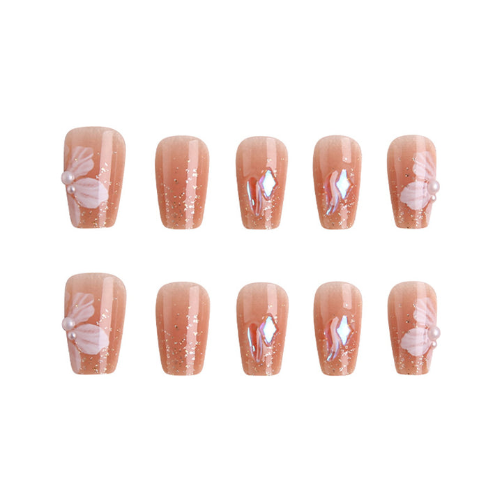 Kunstnagelset mit floralen und glitzernden Akzenten Karnz