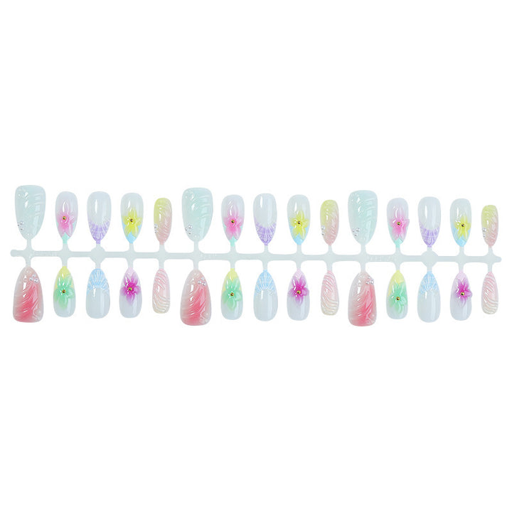 Kunstnagelset mit bunten floralem Design und Glitzerakzenten Karnz