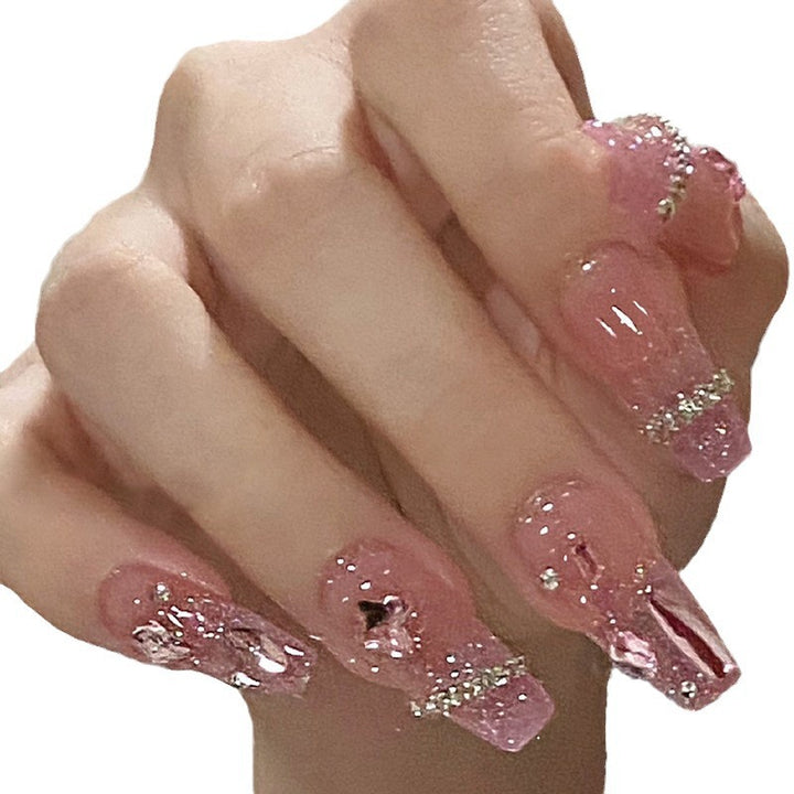 Kunstfingernägel mit Herzmotiv und Glitzerakzenten Karnz