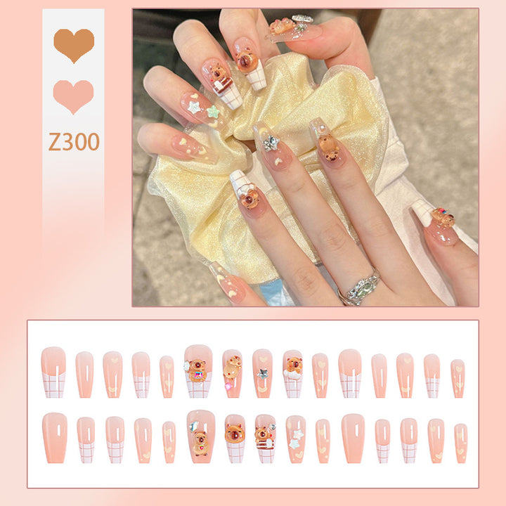Kunstnagelset mit charmantem Tierdesign und funkelnden Kristallverzierungen Karnz