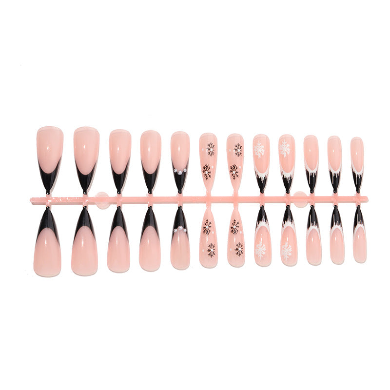 Künstlerisches Stiletto Press-On Nagelset mit dekorativen Schneeflocken-Designs Karnz