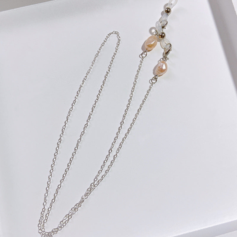 Elegante Schmuckhalterkette mit Perlen- und Goldakzenten Karnz