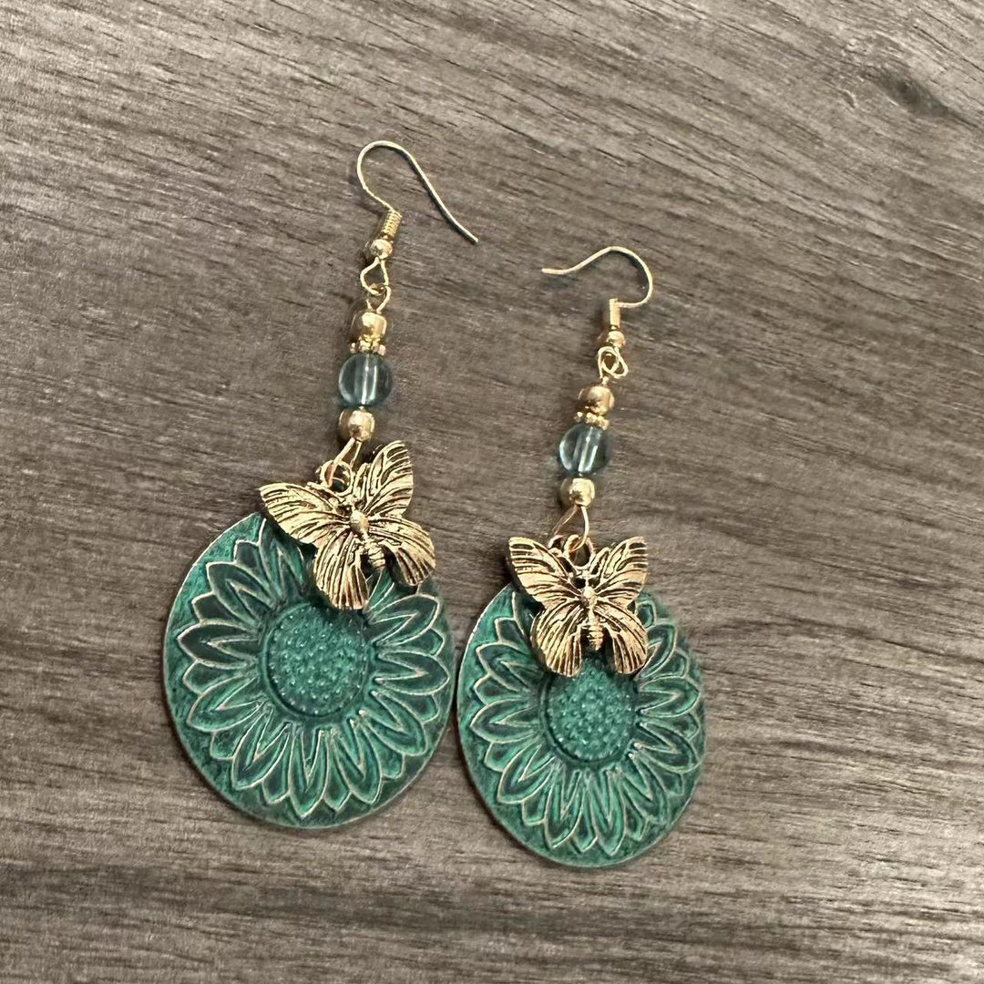 Elegante Ohrhänger mit Blumenmotiv und Schmetterlingen Karnz