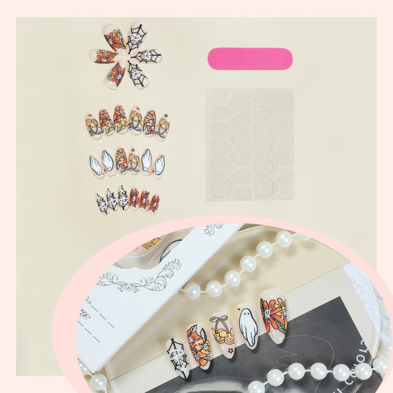 Künstlerisches Press-On-Nagelset mit saisonalen Blumen- und Geisterdesigns Karnz