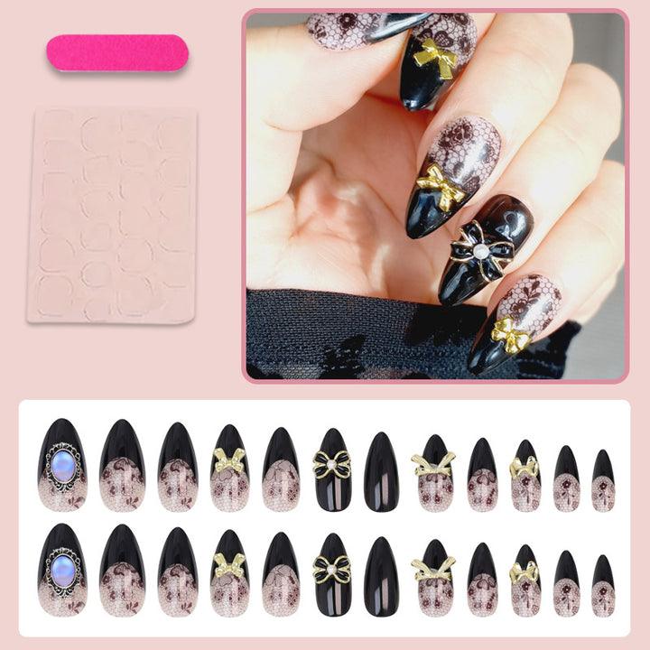 Kunstnagelset mit eleganten Punkt- und Schleifenverzierungen Karnz