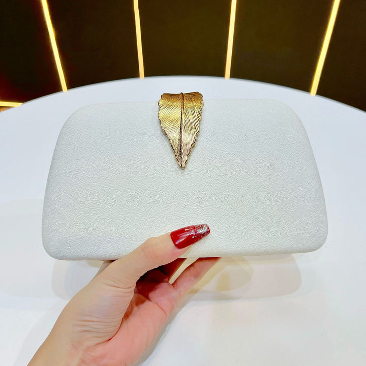 Elegante abendhandtas mit Blattakzenten
