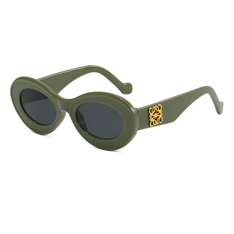 Damen modische Sonnenbrille mit ovalem Rahmen und goldenen Applikationen Karnz