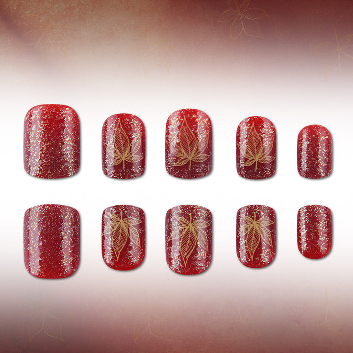 Künstlerisches mit Blättern verziertes Nageldesign Karnz