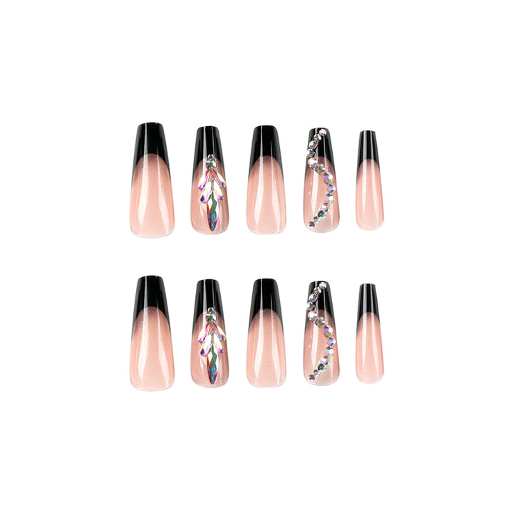 Kunstvolle Stiletto-Nägel mit Glitzerverzierungen Karnz