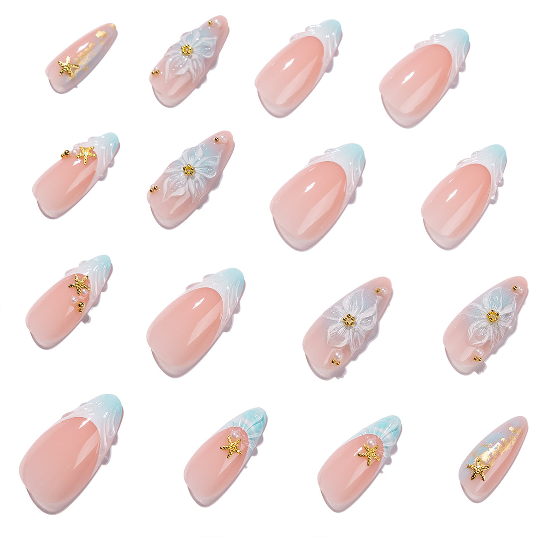 Kunstvolle Stiletto-Nägel mit floralen und glamourösen Akzenten Karnz