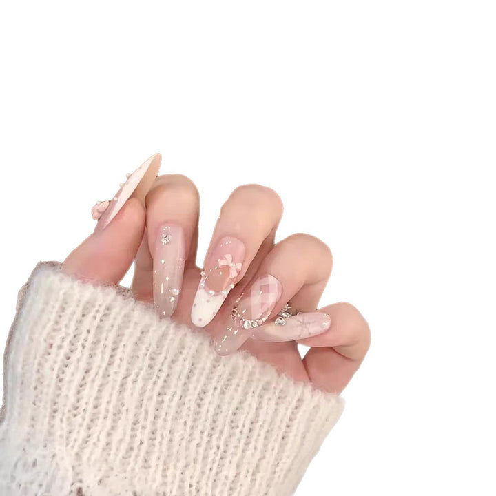 Künstlerisches Lang-Stiletto-Press-On-Nagelset mit dekorativen floralen Akzenten Karnz