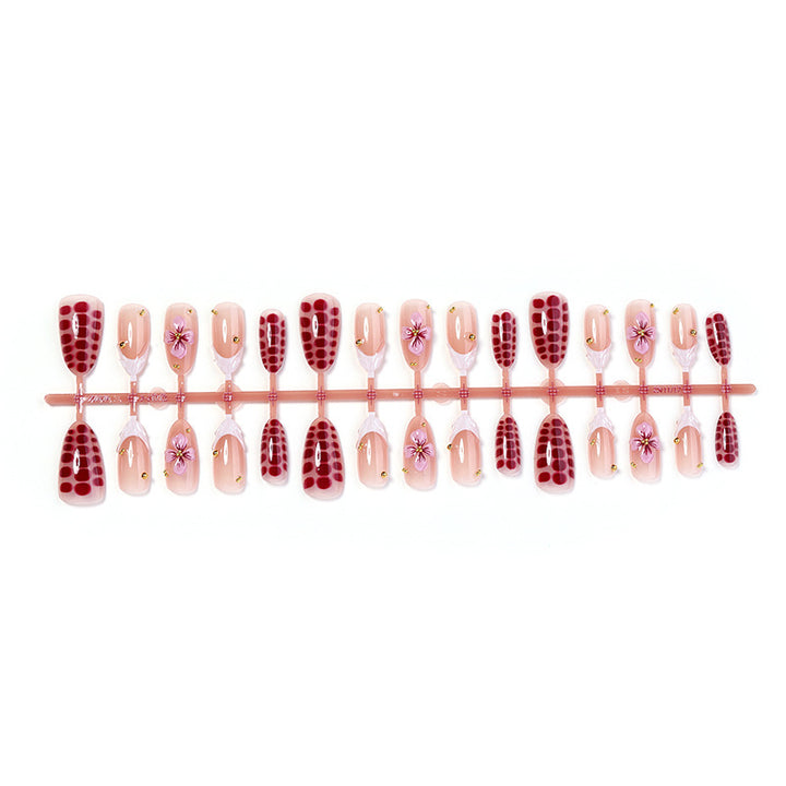 Kunstnagelset mit aufregenden Blumen- und Glitzermotiven Karnz